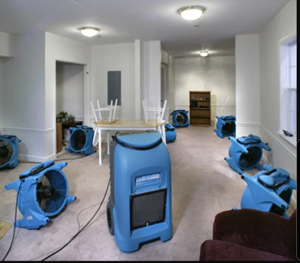 Air movers and dehumidifier setup for Water Damage Restoration in Wareham